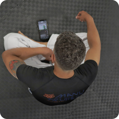 Sportswoman doing abs exercises while following online tutorial over laptop at home 3